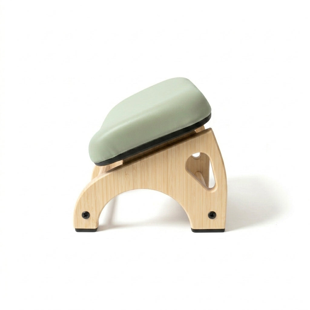 The Bath Horse: a bamboo frame with a sage green padded seat.
